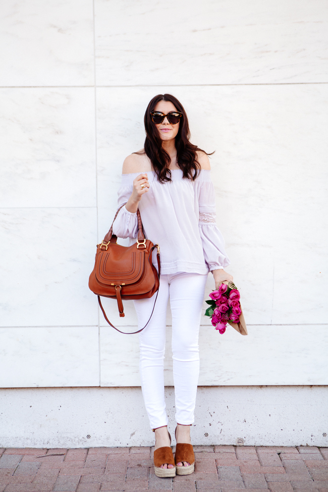 Off the shoulder top and white skinny jeans on Kendi Everyday