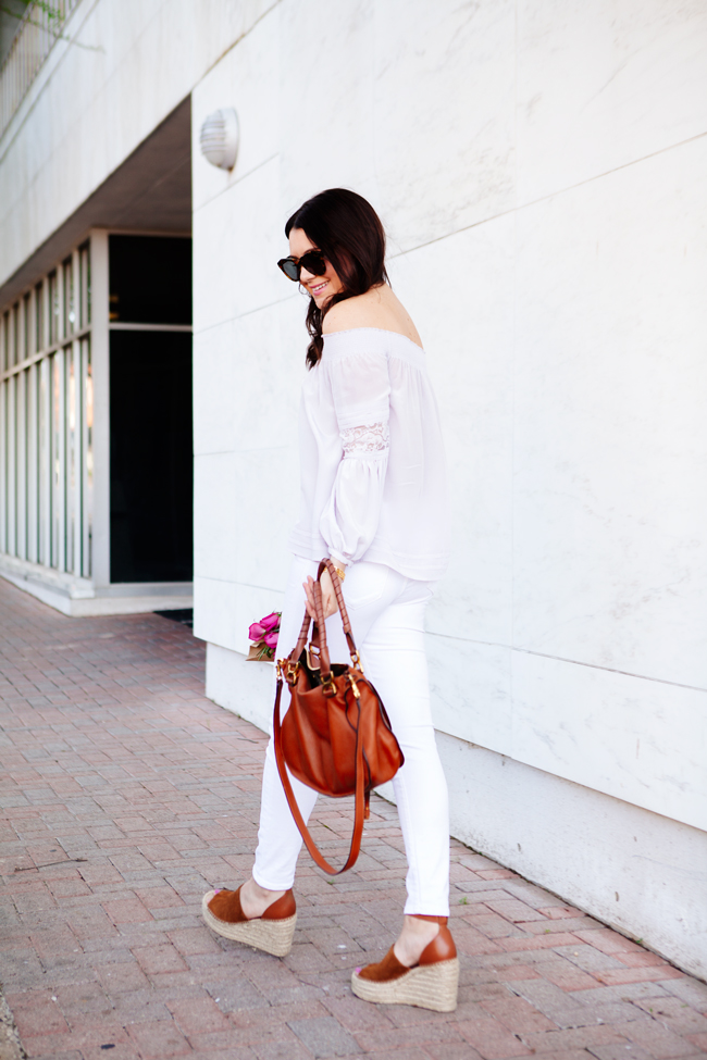 Off the shoulder top and white skinny jeans on Kendi Everyday