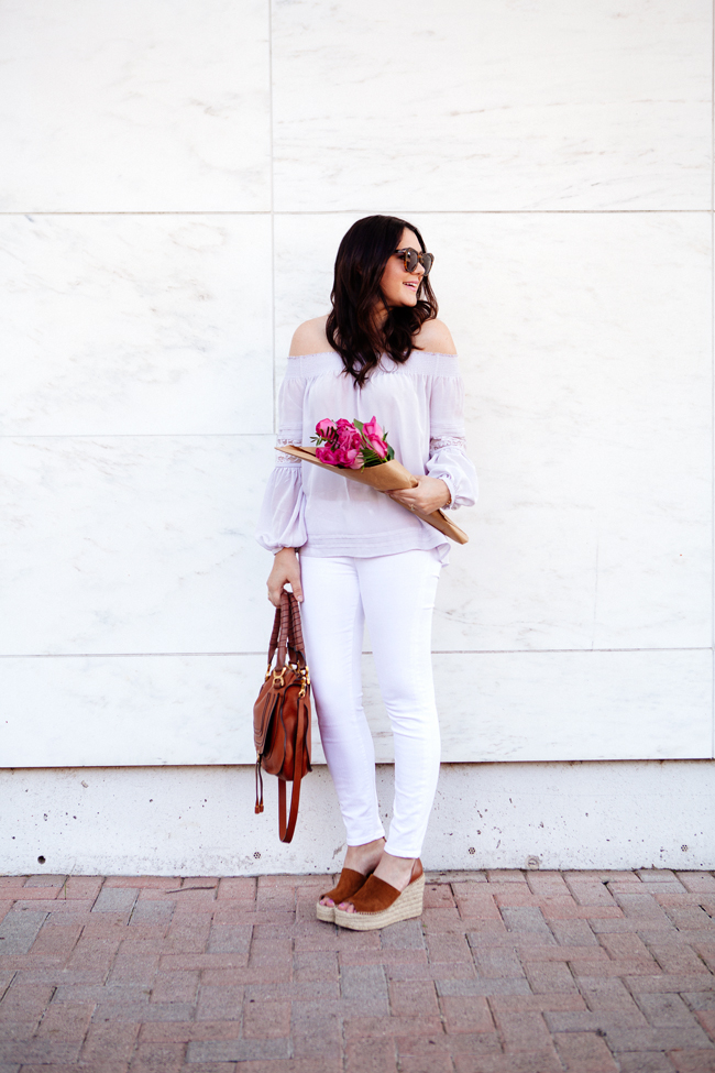 Off the shoulder top and white skinny jeans on Kendi Everyday