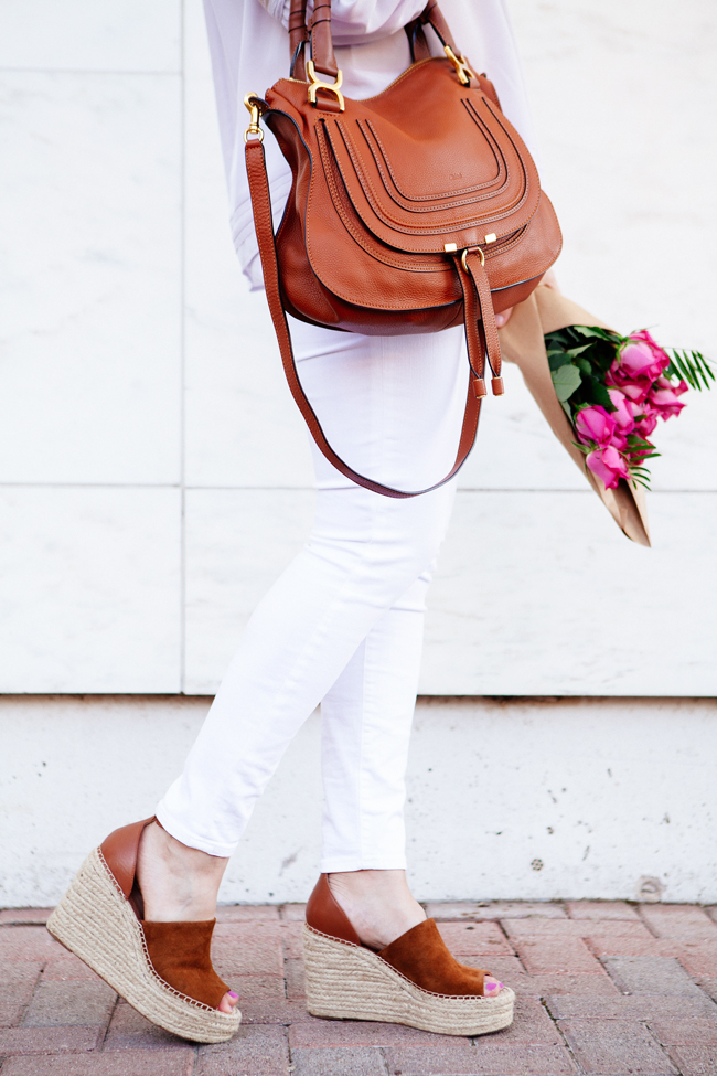 Off the shoulder top and white skinny jeans on Kendi Everyday