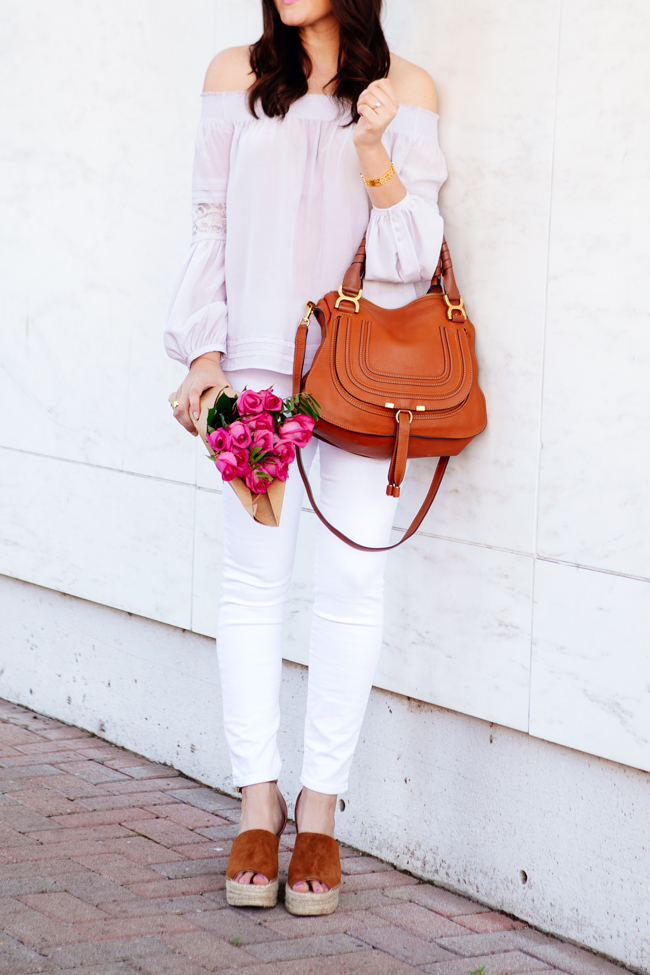 Off the shoulder top and white skinny jeans on Kendi Everyday