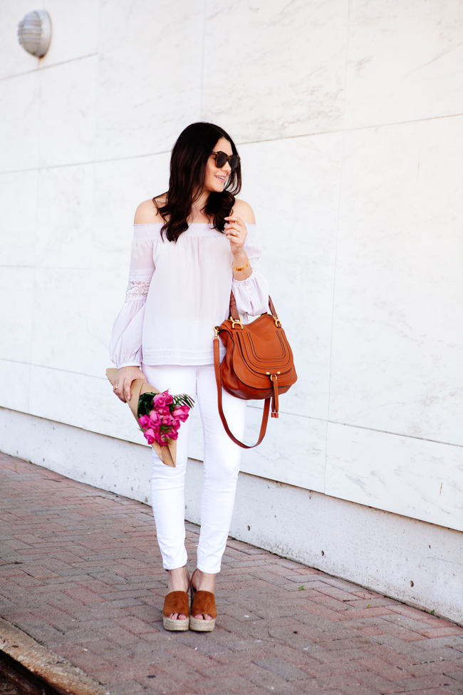 Off the shoulder top and white skinny jeans on Kendi Everyday