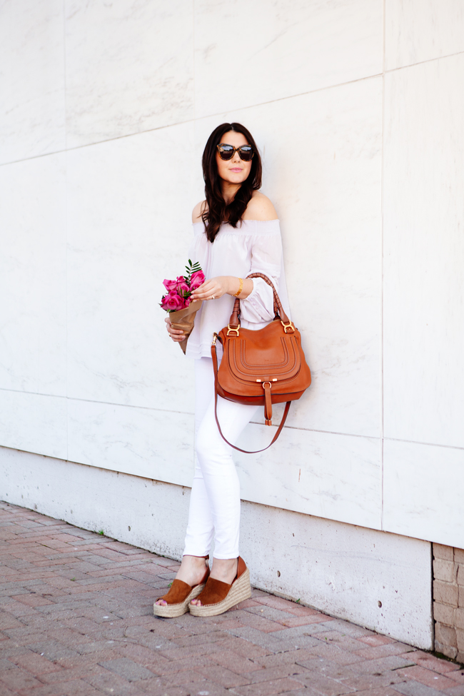 Off the shoulder top and white skinny jeans on Kendi Everyday