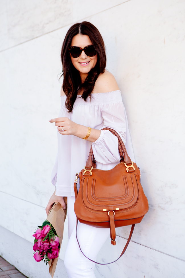 Off the shoulder top and white skinny jeans on Kendi Everyday