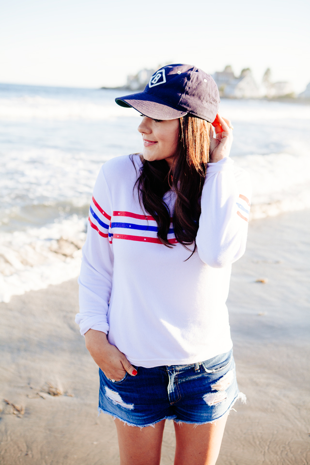 Kendi Everyday wearing a Wildfox Striped Sweatshirt and denim cut Offs on the beach