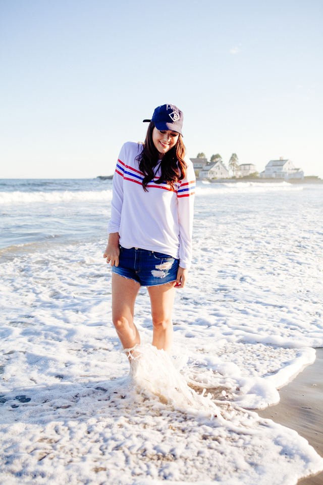 Kendi Everyday wearing a Wildfox Striped Sweatshirt and denim cut Offs on the beach