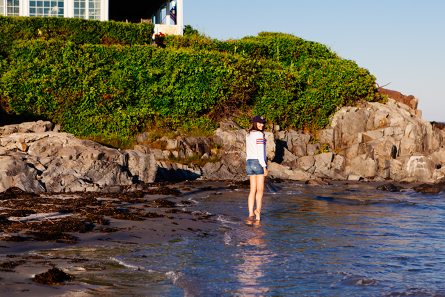 Kendi Everyday wearing a Wildfox Striped Sweatshirt and denim cut Offs on the beach