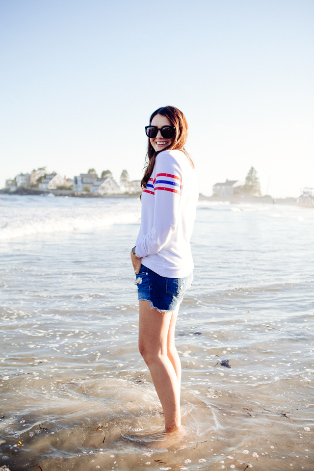 Kendi Everyday wearing a Wildfox Striped Sweatshirt and denim cut Offs on the beach