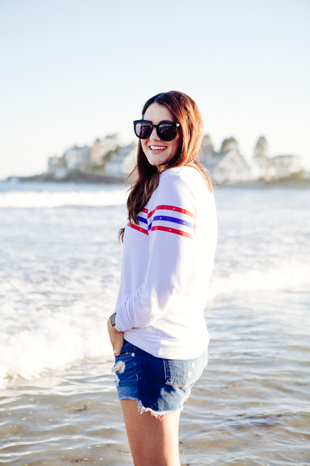 Kendi Everyday wearing a Wildfox Striped Sweatshirt and denim cut Offs on the beach