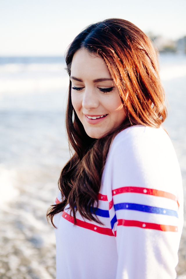 Kendi Everyday wearing a Wildfox Striped Sweatshirt and denim cut Offs on the beach