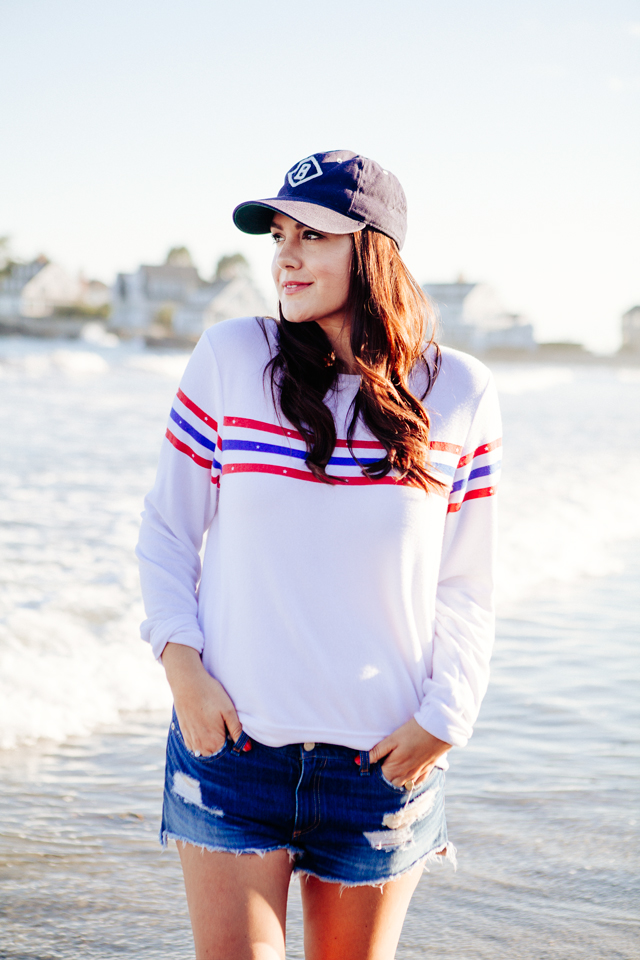 Kendi Everyday wearing a Wildfox Striped Sweatshirt and denim cut Offs on the beach