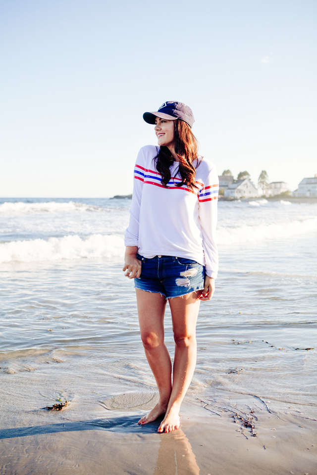 Kendi Everyday wearing a Wildfox Striped Sweatshirt and denim cut Offs on the beach