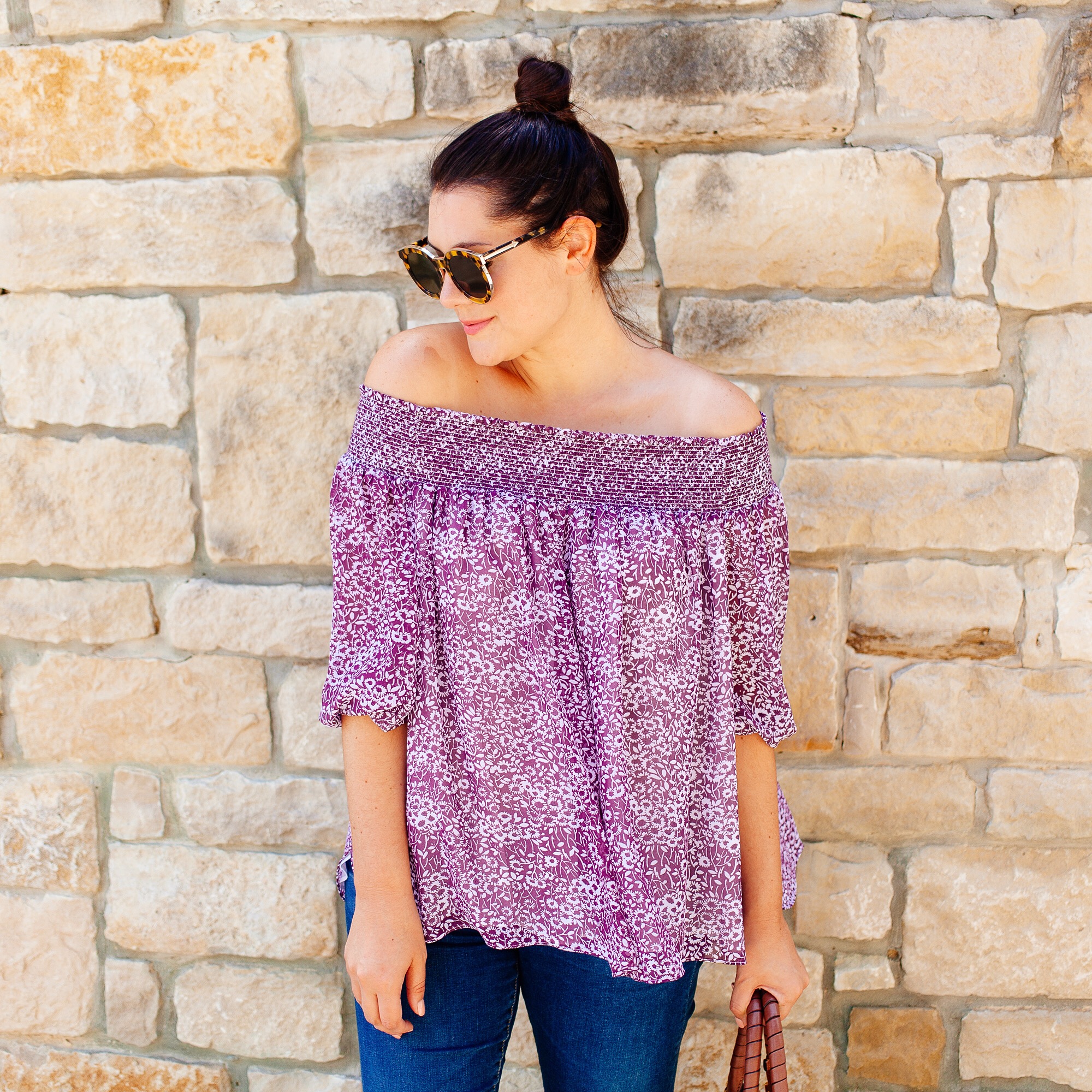 Lavender off the shoulder top with a top knot on Kendi Everyday 