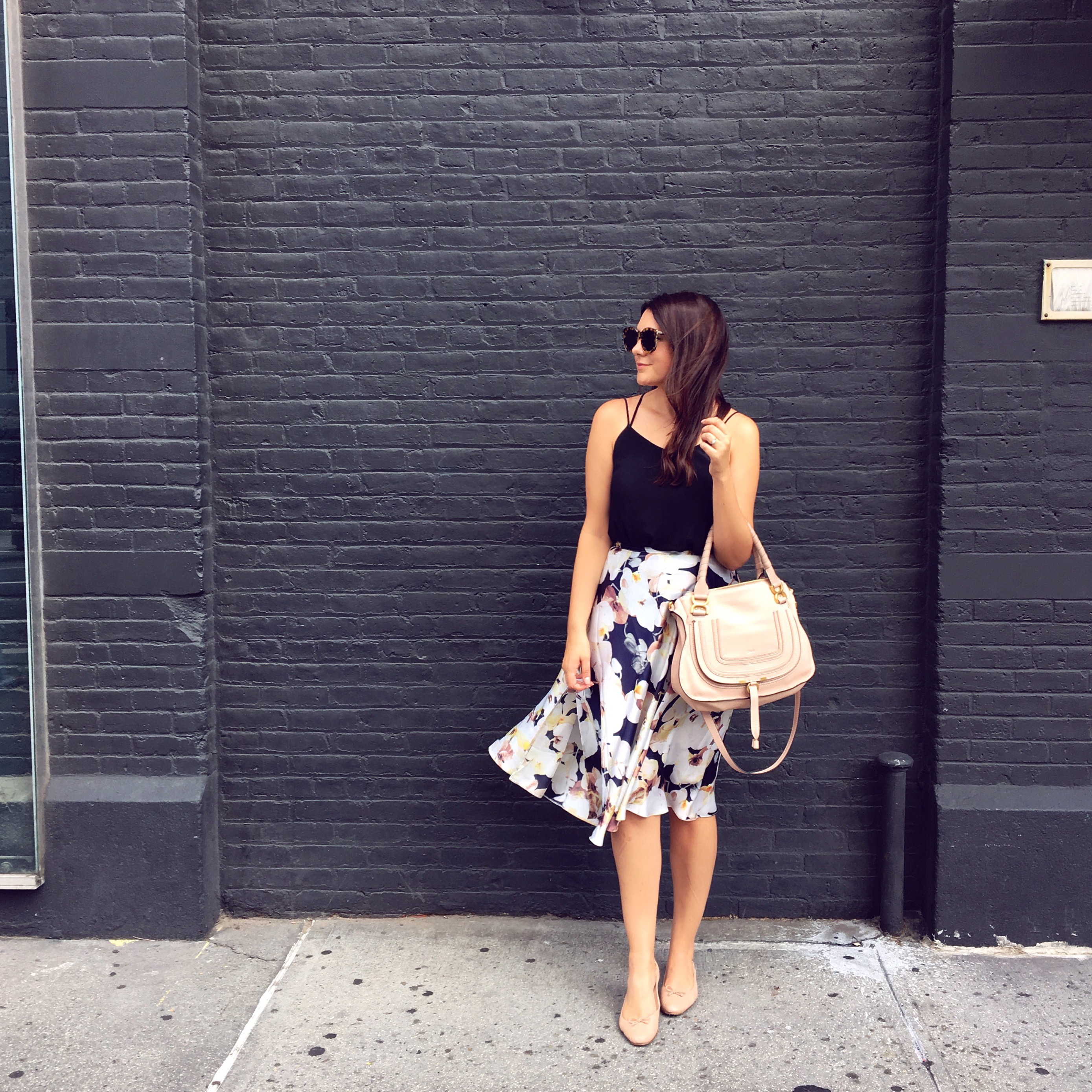 Floral skirt and black camisole with nude accessories on Kendi Everyday.