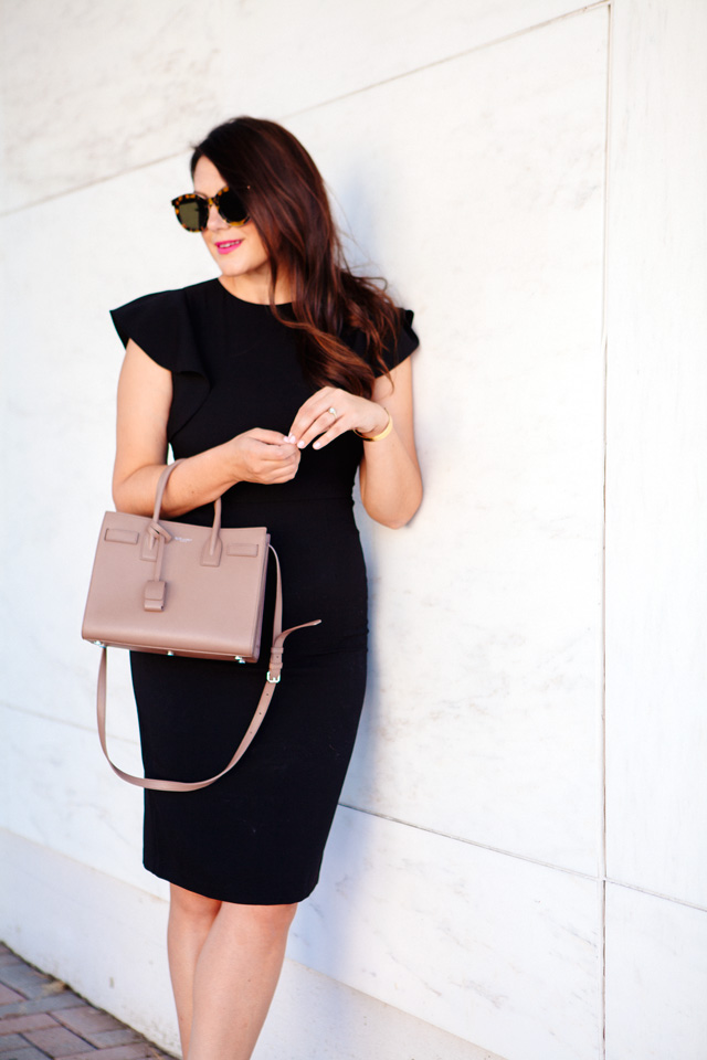 Kendi Everyday in Little Black Dress with Ruffle Sleeves. 