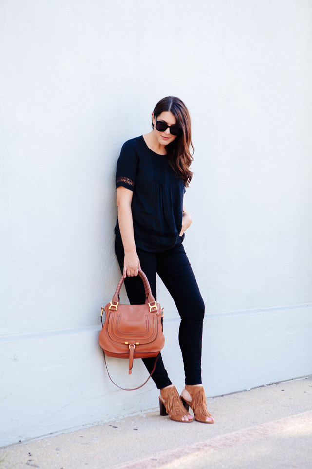 Black on black outfit with cognac accessories. 