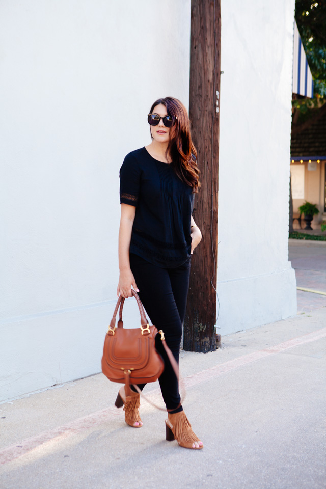 Black on black outfit with cognac accessories.
