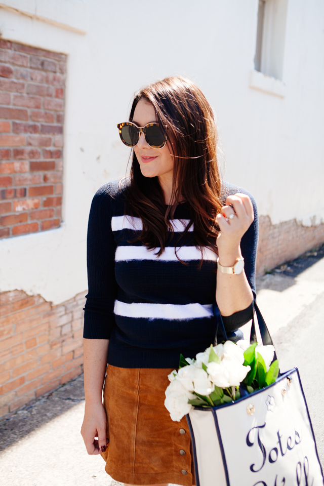 Striped sweater with suede mink skirt and tote with flowers on Kendi Everyday