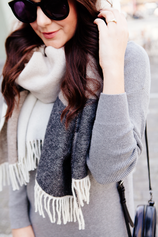 Grey sweater dress with oversized scarf in Lucerne. 