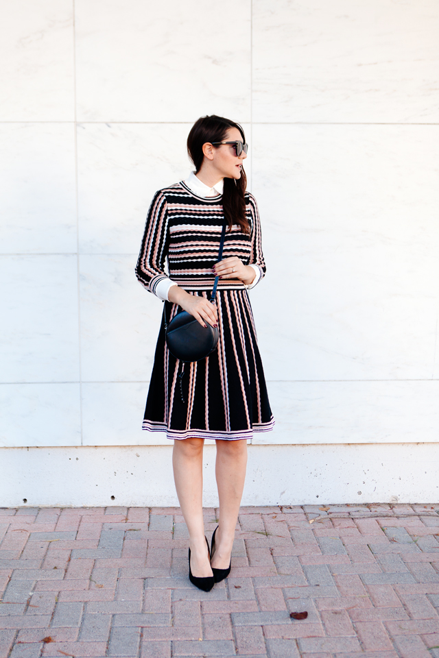 Kate Spade sweater dress with ruffle collar shirt and black cross body purse. 