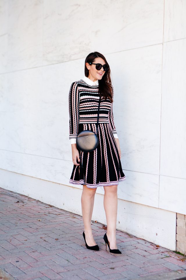 Kate Spade sweater dress with ruffle collar shirt and black cross body purse. 