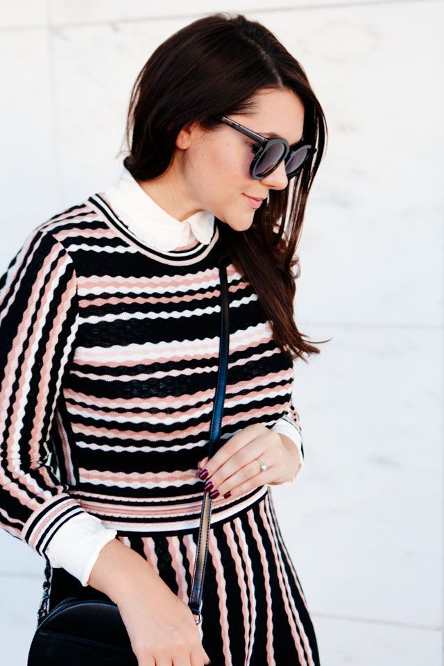 Kate Spade sweater dress with ruffle collar shirt and black cross body purse. 