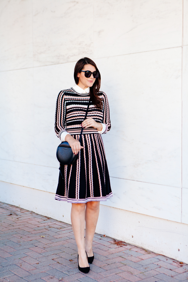 Kate Spade sweater dress with ruffle collar shirt and black cross body purse. 