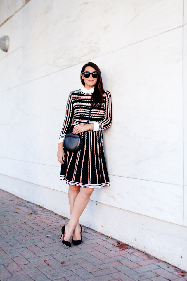 Kate Spade sweater dress with ruffle collar shirt and black cross body purse. 