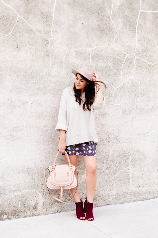 Floral mini skirt and oversized sweater from LOFT. 