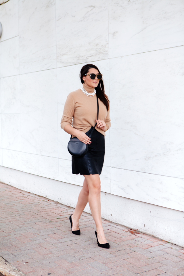 Cowl neck sweater and layered peal necklace with faux leather skirt.
