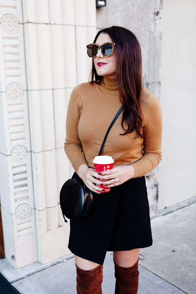 Fall outfit featuring camel turtleneck with black wrap skirt and over the knee boots.