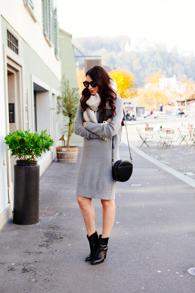 Grey sweater dress with oversized scarf in Lucerne. 