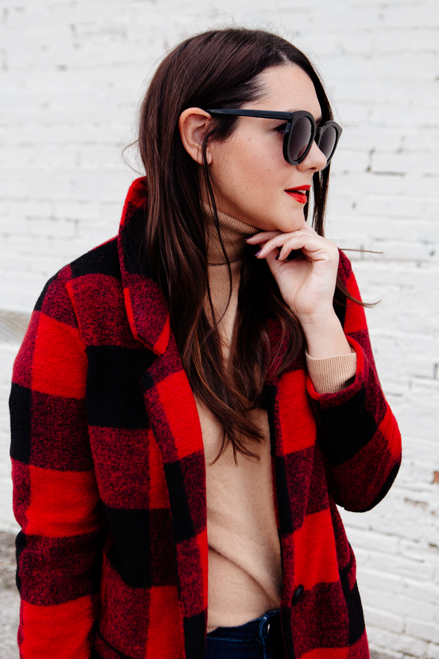 Buffalo plaid jacket with camel sweater and black heels on Kendi Everyday.