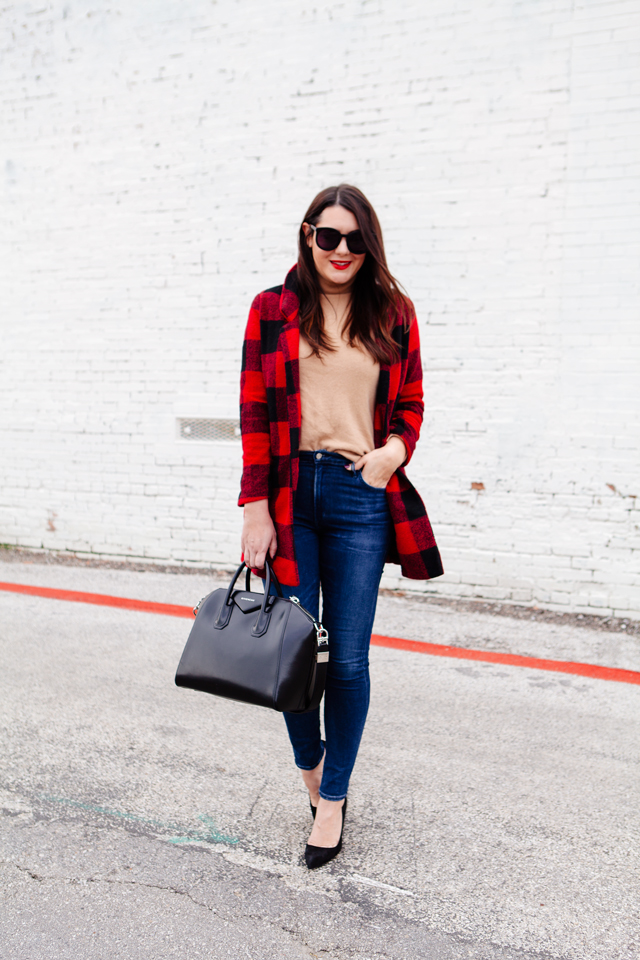 Buffalo plaid jacket with camel sweater and black heels on Kendi Everyday.