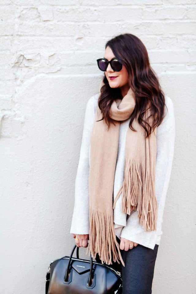 Oversized scarf with sweater and pom pom sneakers on Kendi Everyday.