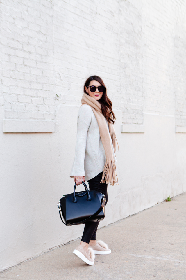 Oversized scarf with sweater and pom pom sneakers on Kendi Everyday.