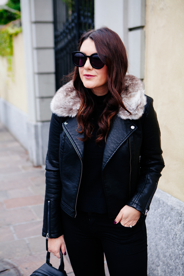 Black moto jacket with fur collar and black denim on Kendi Everyday