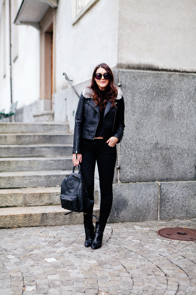 Black moto jacket with fur collar and black denim on Kendi Everyday