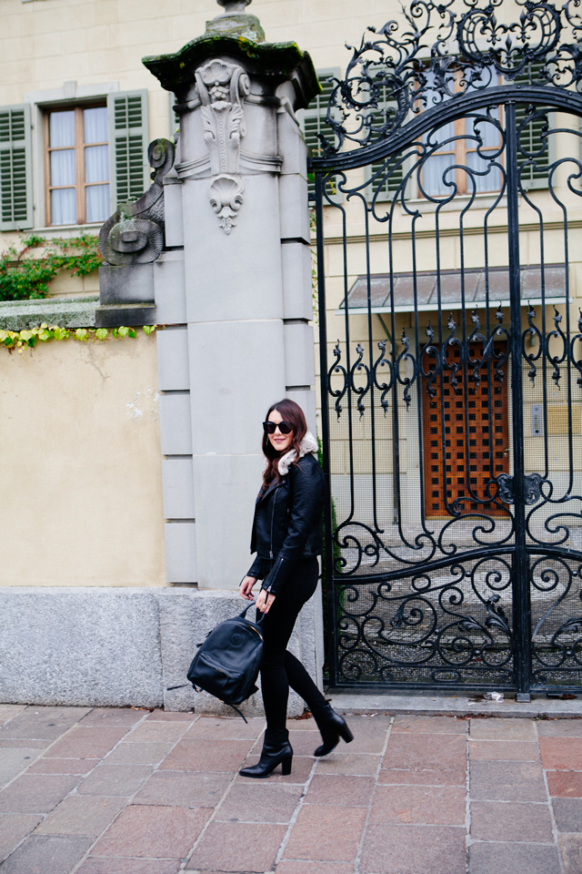 Black moto jacket with fur collar and black denim on Kendi Everyday