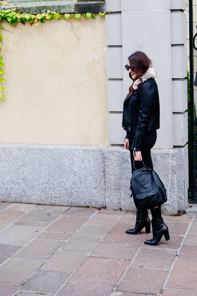 Black moto jacket with fur collar and black denim on Kendi Everyday