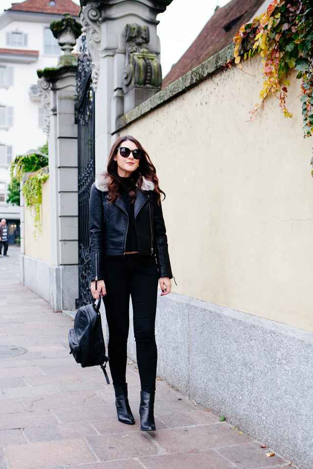 Black moto jacket with fur collar and black denim on Kendi Everyday