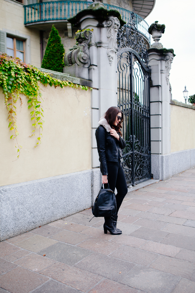 Black moto jacket with fur collar and black denim on Kendi Everyday