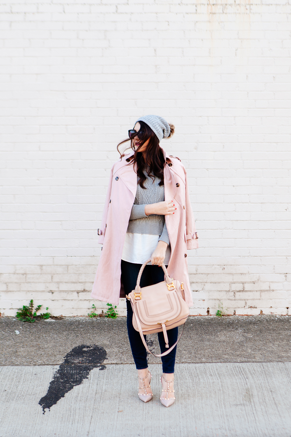 Light pink trench and layered sweater on Kendi Everyday.