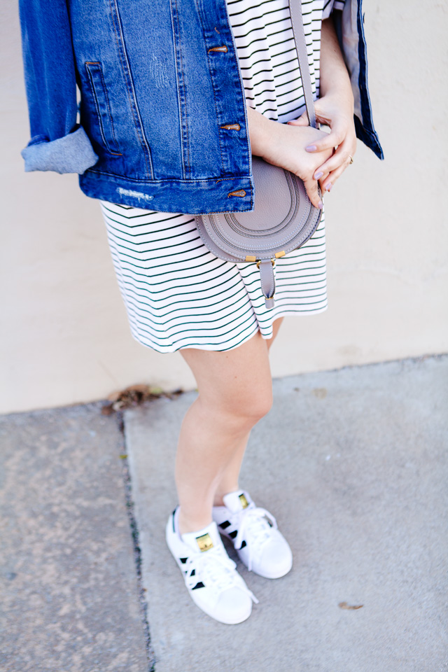 black and white striped dress with denim jacket and adidas superstars