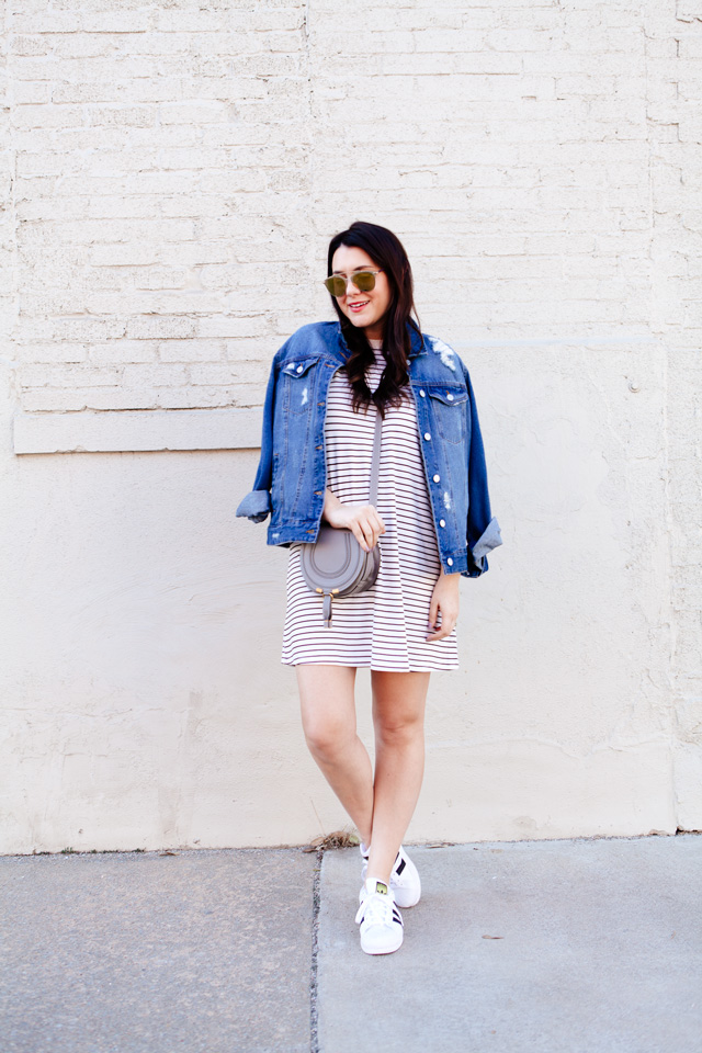 black and white striped dress with denim jacket and adidas superstars