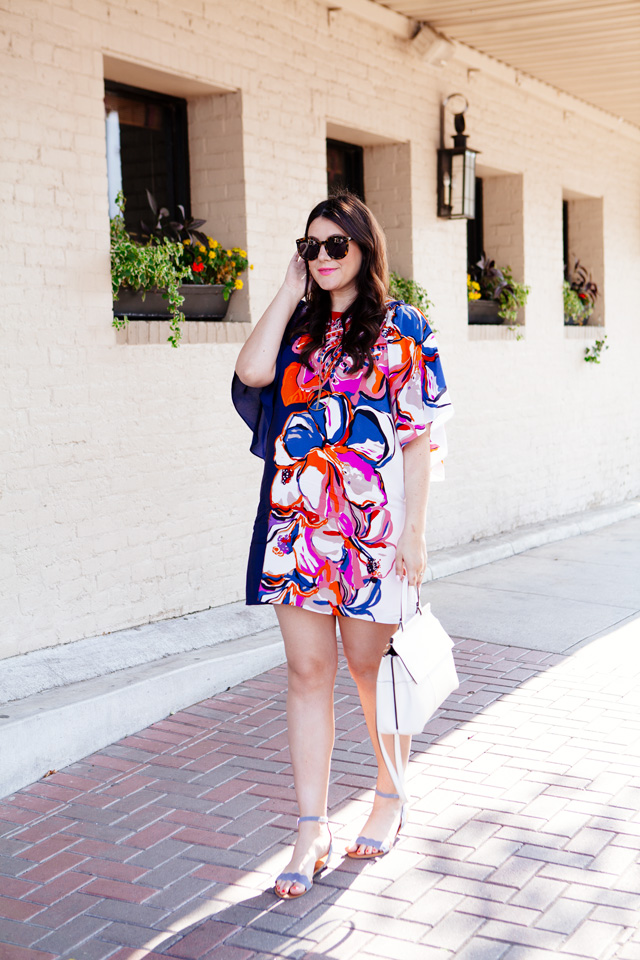 Silk floral dress with white handbag