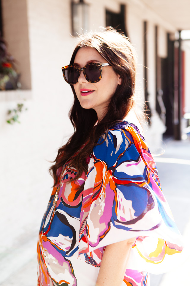 Silk floral dress with white handbag