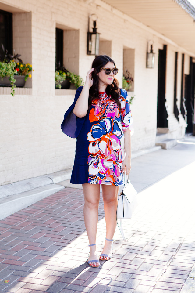 Silk floral dress with white handbag