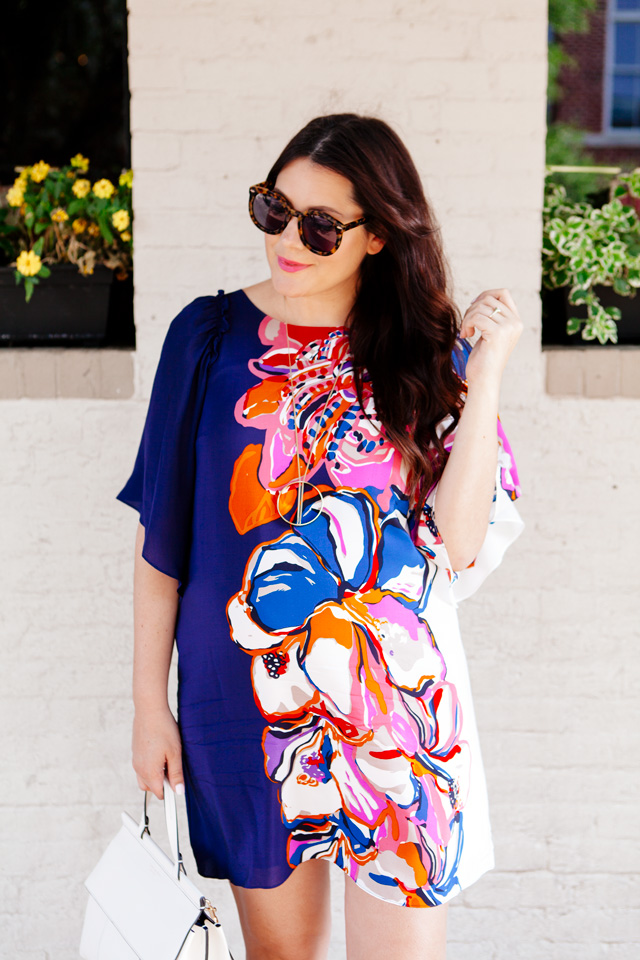 Silk floral dress with white handbag